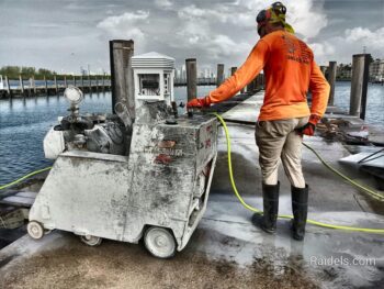 Cutting sections of the pier in Fisher Island in Miami Beach